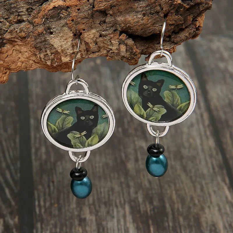 Aretes colgantes vintage con gato negro tropical