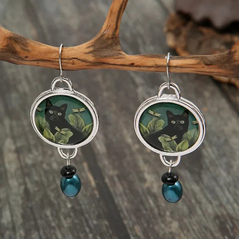 Aretes colgantes vintage con gato negro tropical