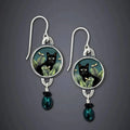 Aretes colgantes vintage con gato negro tropical